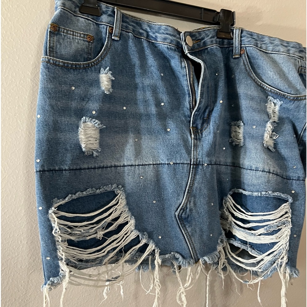 Distressed denim short skirt